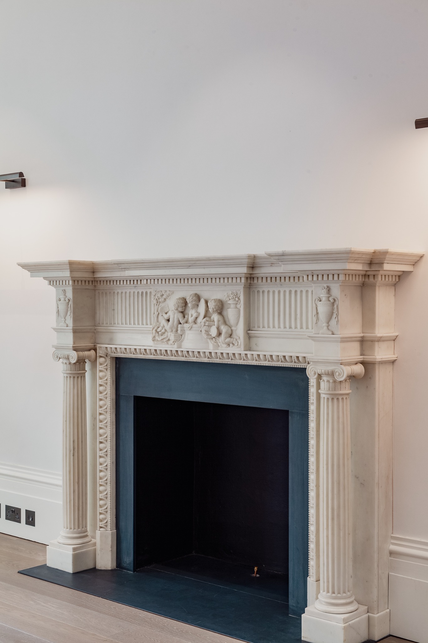 Carved stone fireplace in a Holland Park house